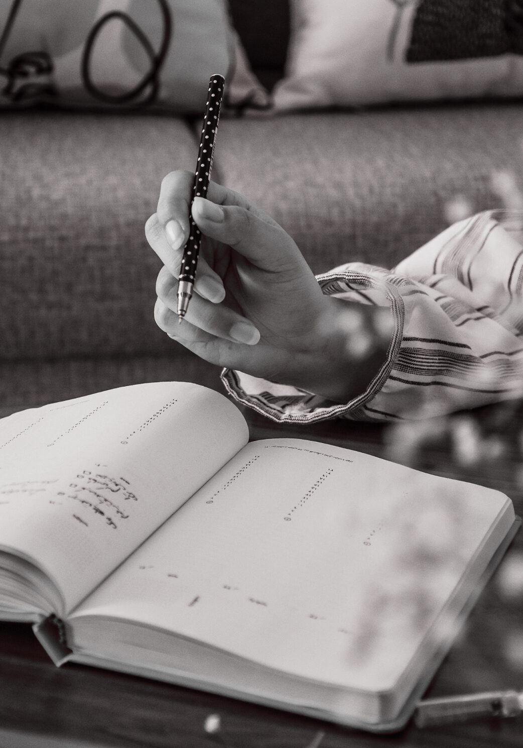 Woman Writing on calendar - Contact J. Harrington